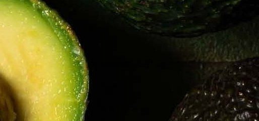 Fresh Helvetica avocados, whole and halved